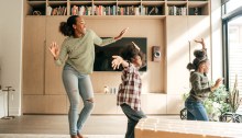 Mother and kids dancing